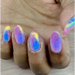 A vibrant and mesmerizing glitter effect. This design features a multi-tonal blend of pink, blue, and yellow glitter, creating an iridescent, galaxy-like look that sparkles from every angle.