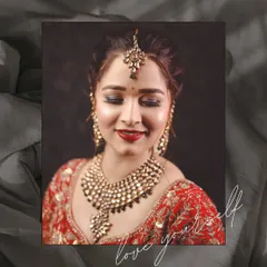 A serene and beautiful portrait of a bride with her eyes closed, showcasing her flawless makeup and stunning Kundan jewelry. This shot is all about quiet elegance.