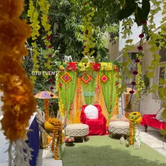 Another angle of the garden Mehendi setup, showing how the hanging floral strings and side props create a complete, immersive festive environment.