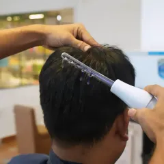 My high-frequency scalp treatment is a gentle, non-invasive way to promote a healthier scalp environment. It helps to purify the skin and stimulate circulation, which is essential for hair growth.