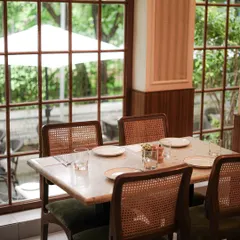 Our cafes are designed to be your comfortable escape. Tucked inside beautiful lifestyle stores, each location offers a serene, elegant setting with large windows that look out onto lush greenery, perfect for a quiet meal or a coffee break.