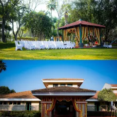A wide view of an outdoor wedding venue, showing the elegant guest seating and the beautifully adorned mandap.