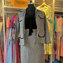 This checkered blazer and skirt set is my modern take on professional attire. Paired with a simple knot shirt, it’s a versatile outfit that transitions seamlessly from a formal meeting to a chic evening out, offering a look that is both sharp and stylish.