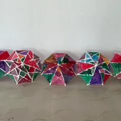 A beautiful lineup of the finished umbrellas from our workshop. Each one is unique and shows the individual creativity of every child.