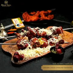 This is what cheesy obsession looks like. Our Chicken Cheese Overload Tandoori features skewers of tender chicken tikka buried under a mountain of grated cheese, a perfect fusion of smoke and melt.