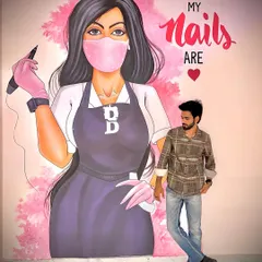 Me standing in front of the mural at my studio. The quote "I'm not perfect but my nails are" is my motto.