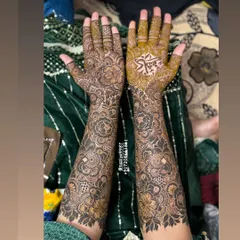 An engagement bride's mehendi, featuring her partner's name 'Kashif' beautifully written in Arabic calligraphy on the palm.