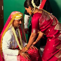 Participating in a traditional ceremony at my brother's wedding. These rituals are an important part of my Kodava identity.