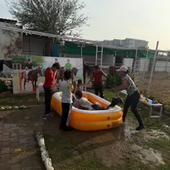 Guests enjoying a water fight in and around the pool during our lively Holi festivities.