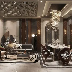 We welcome you to a world of luxury with this living and dining space. A mesmerizing chandelier hangs over the double-height dining area, while modern furniture and zebra-print accents add a contemporary and playful touch.