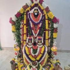 An elaborate alankaram for a Satyanarayana pooja, one of the most frequently requested ceremonies for family harmony and prosperity.