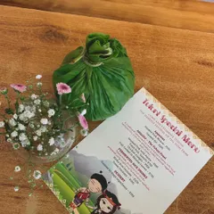 Our special menu for the Tuluni festival, featuring traditional dishes like smoked pork with bamboo shoot and fermented rice drinks. The food parcel is wrapped in a leaf, the traditional way.