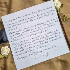 The finished piece of a beautiful anniversary poem, "I carry your heart with me". Written in an elegant Copperplate script, it’s a classic and powerful way to express love.