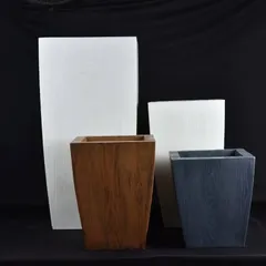 A collection of square and rectangular planters with a wood-grain finish. These fiber pots give the look of wood without the weight or risk of rotting.