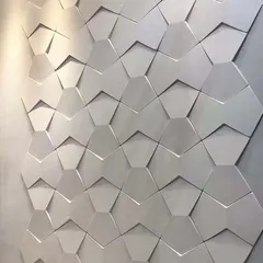 This 3D hexagonal wall panel creates a dynamic and futuristic effect through its play on light and shadow. It's a great way to add texture and a modern artistic touch to any room.