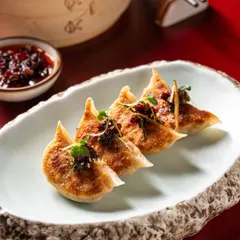 Our Corn & Cheese Gyoza are flash-fried to a perfect golden crisp and served with artisanal kimchi and fragrant chilli oil for a refined, flavour-packed appetizer.