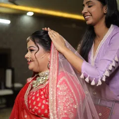 My talented assistant ensuring the bride's veil is perfectly placed and secure before she walks down the aisle.