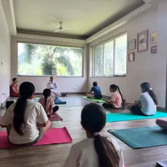 A view from the back of the class shows a group of children peacefully engaged in a mindfulness exercise. It's a powerful sight to see them find stillness together in our shared space.