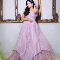 A full shot of our beautiful lilac ball gown. The layered tulle skirt and floral applique on the bodice create a true fairytale look.