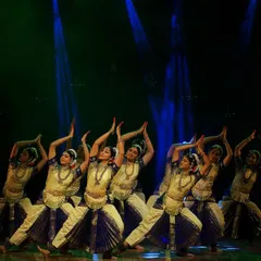 The Natyanjali ensemble in a moment of perfect synchronicity. Our group performances are built on years of shared practice, creating a seamless flow of movement and emotion under the stage lights.