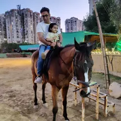 We love creating unforgettable family moments. Here, a father enjoys a safe and gentle ride with his young daughter, showing that horse riding can be a joy for all ages.