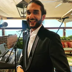 All smiles before the gig starts. Our vocalist Aryaman looking happy and ready to perform at a daytime event.