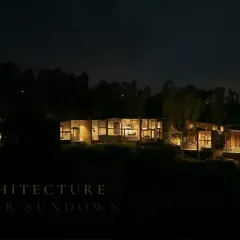 Glow mode: ON. This eco-resort, nestled in a forest, is lit thoughtfully after sundown, creating a warm and inviting presence that respects the natural surroundings.