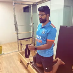 Here, a client is using the Pilates reformer for rotator cuff rehabilitation. The controlled resistance is perfect for strengthening the delicate muscles of the shoulder safely and effectively.