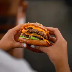 At my crafthouse, magic is often just passion and the right ingredients. My Chef hits the perfect meat-to-fat ratio for a melt-in-your-mouth experience. This is a classic-style burger where the choicest cuts are the hero.