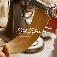 Using a stand mixer with a pasta roller attachment is a great way to get perfectly thin and even sheets of dough, ready for cutting or shaping.