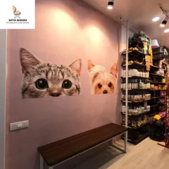 To add a touch of personality, I incorporated this charming wall decal in the pet shop. It creates a perfect Instagrammable spot and reinforces the brand's friendly, pet-centric identity, making the space more memorable for visitors.