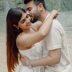 An intimate and joyful moment between Kunal and Disha on a beach in Thailand, capturing their genuine connection.