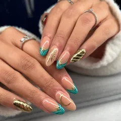 A full view of both hands, showcasing the balance and artistry of this celestial-themed manicure. The combination of hand-painted art and sculpted gold creates a rich, textured look.