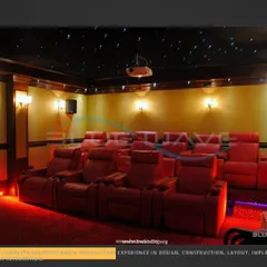 This project showcases a classic tiered seating layout with red leather recliners. The raised platforms ensure that every seat has a clear, unobstructed view of the screen, just like in a commercial theater.