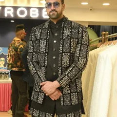 A front-facing view of the bold black and silver patterned jacket, showcasing its intricate design and sharp tailoring.