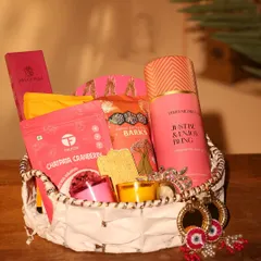 A full view of the modern Diwali hamper in a chic white woven basket. It's a fresh and contemporary take on festive gifting.
