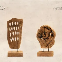 A pair of contrasting artifacts. One features the perforated design, while the other is a more solid, gnarled piece of teak, showcasing the diverse forms found in nature.