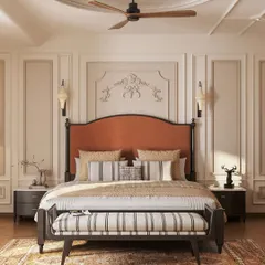 This master bedroom is a study in neoclassical elegance. We used classic wall moldings, a timeless two-poster bed with a rich rust-orange headboard, and a balanced, neutral palette to create a sanctuary that feels both grand and deeply restful.