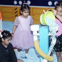 Teamwork makes the dream work! Young children collaborate at our sensory play station, learning and having fun together.