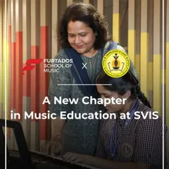 We are proud to announce a new chapter in music education with our partner school, SVIS. This image shows a teacher guiding a student at the piano, symbolizing our commitment to nurturing talent within the school system.
