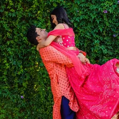 A moment of pure joy and abandon. The groom lifts his bride, and her laughter fills the air. It's these unscripted, happy moments that I love to capture.