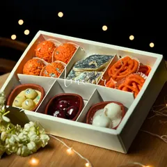 A beautifully styled shot of my Mithai Candle Gift Box, featuring a variety of sweet-inspired candles like Motichoor Ladoo, Kaju Katli, and Rasgulla. This is a unique Diwali gift that combines tradition with modern artistry.