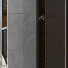 This image captures the clean, horizontal lines of a grey stone-tiled wall in a modern bathroom. The subtle texture of the stone adds depth and character, complementing the dark wood elements of the space.