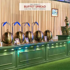 A perfect buffet spread for perfect dining. This image highlights our classic setup with gleaming golden chafing dishes arranged on a beautifully lit counter, ready to serve a variety of delicious hot dishes to your guests.