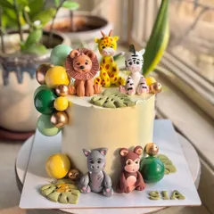 Where the jungle comes to life! This roarsome cake is loaded with adorable, hand-crafted fondant animal figurines like a lion, giraffe, and zebra, perfect for a little one’s big day.
