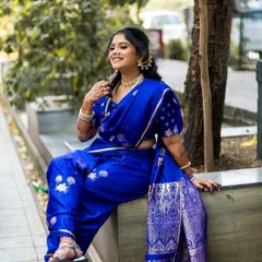 This bride is wearing a comfortable and modern "duet" style draped Nauvari for her engagement, showing the versatility of this traditional garment.