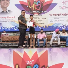 Another winner from our academy, Yuvraj Parmar, accepts his silver medal at the Parle Mahotsav. We train our students to compete with confidence and sportsmanship at every level.