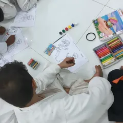 A little joy time for my karatekas. An overhead view of the students focused on their coloring sheets after class.