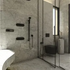 The walk-in shower area features sleek, minimalist black fixtures that stand in sharp contrast to the soft grey marble. The curved glass partition maintains the room's sense of fluidity and openness.