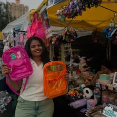 Look at these cool custom initial backpacks I made at a pop-up. I can personalize bags on the spot, making for a super unique and useful party favor.